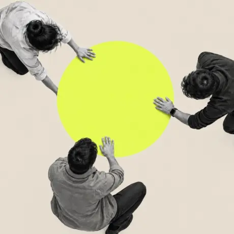 Collage of three people, seen from above, pushing a yellow circle together