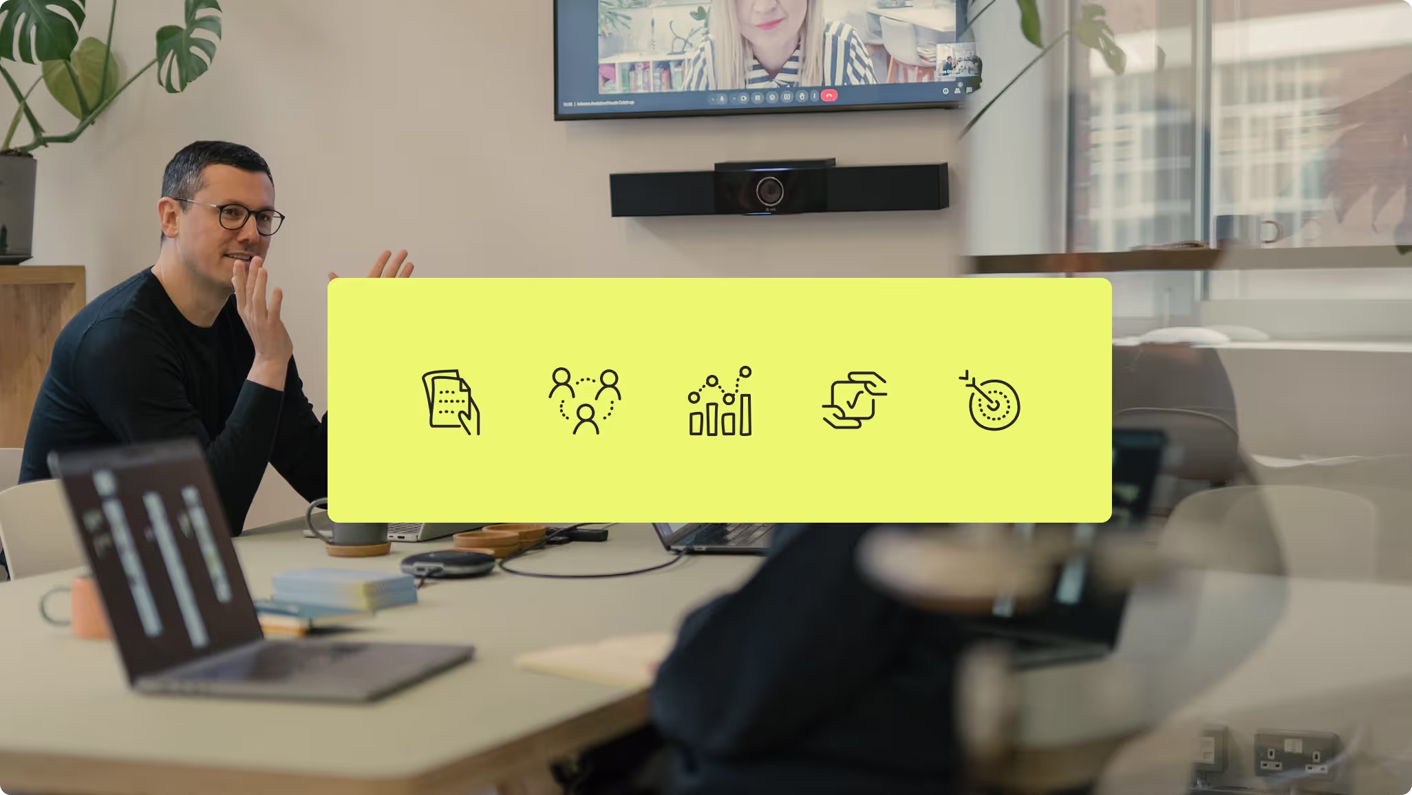 Team member talking in a meeting beside icons for documents, collaboration, charts, agreement and targets