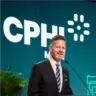 Adam Andersen speaking on stage at a CPHI event