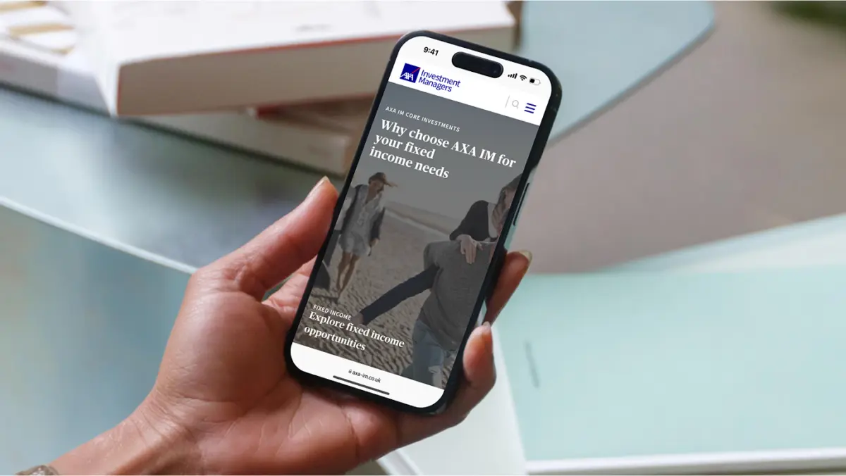 Hand holding a phone showing the AXA IM fixed income page