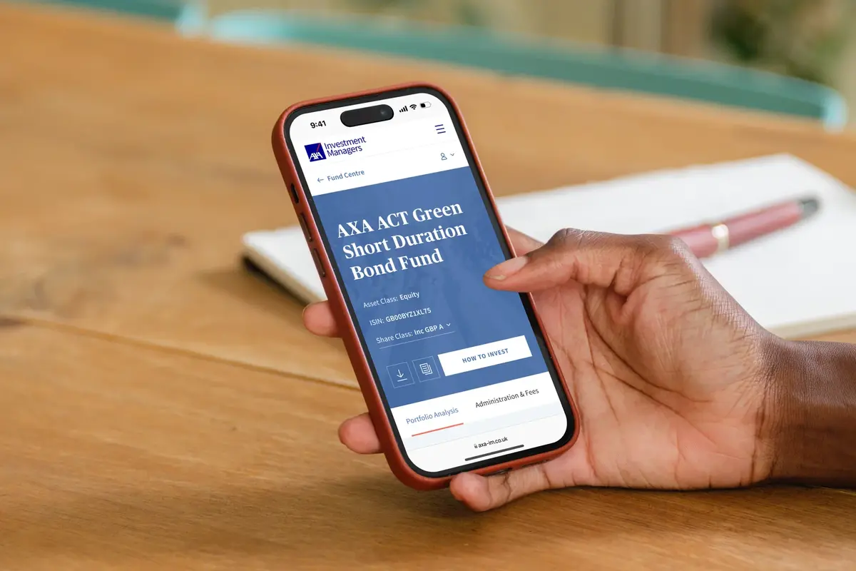 Hand holding a phone showing the AXA ACT Green Short Duration Bond Fund page