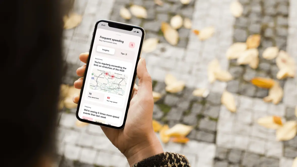 Phone showing a frequent speeding insight with a route map